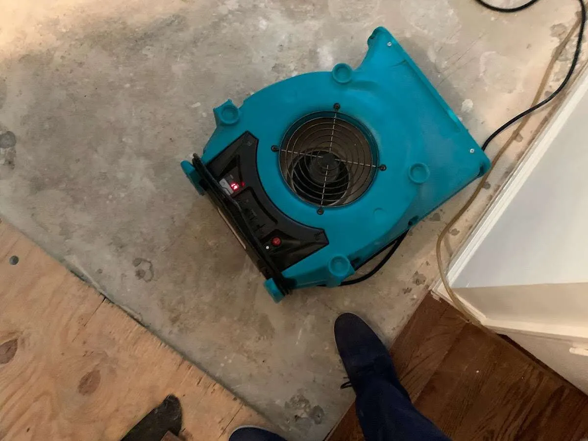 Air mover drying subfloor during Leak Detection & Repair in Santa Paula